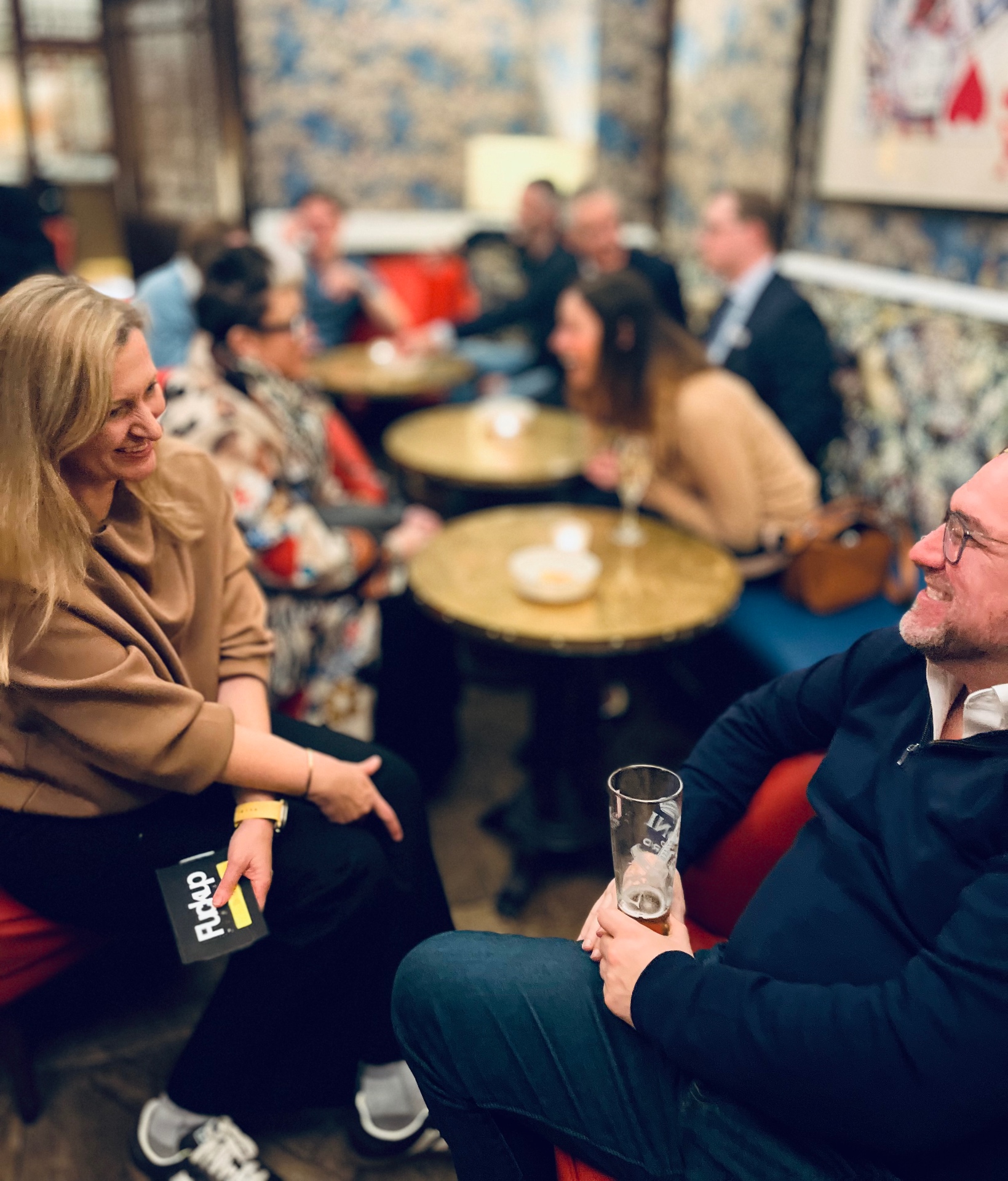 Two members in conversation across the lounge tables