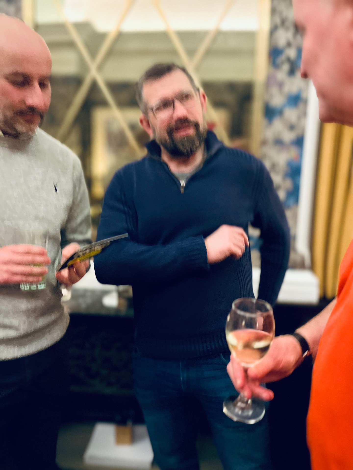 Founders swapping cards over drinks